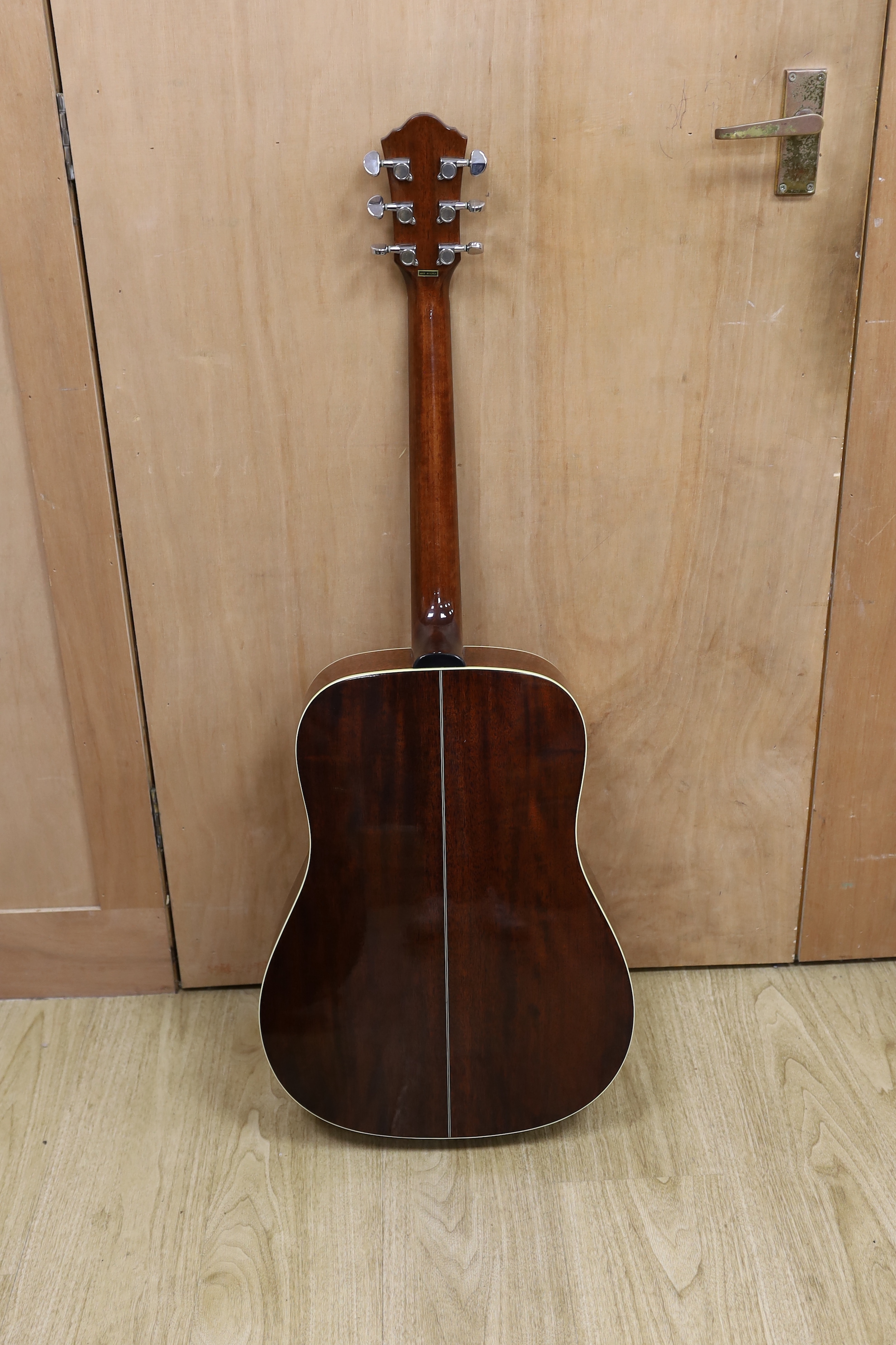 A cased Ibanez acoustic guitar